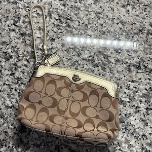 Coach wristlet tan with gold accents